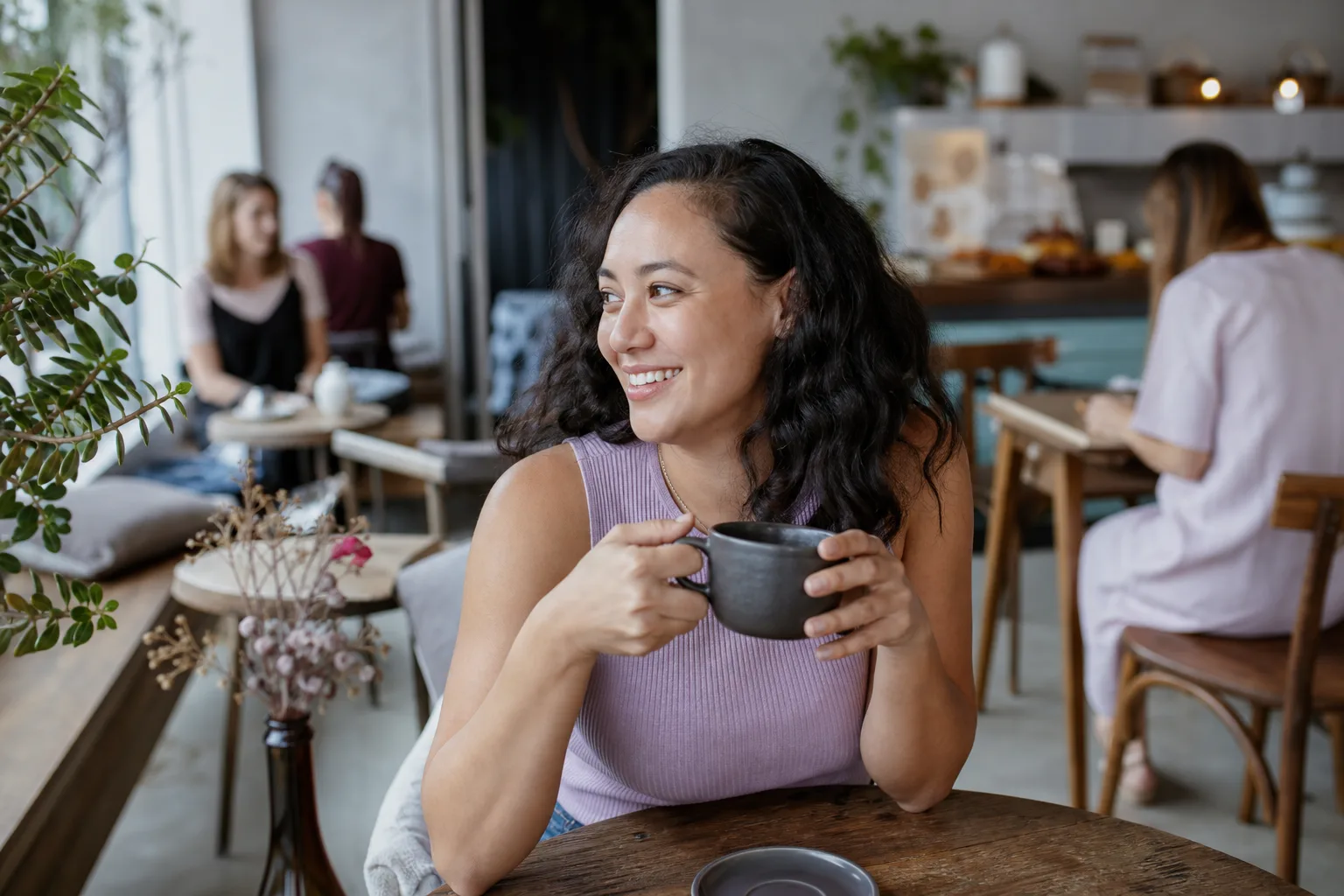 Two people talking over coffee in a Norfolk market town