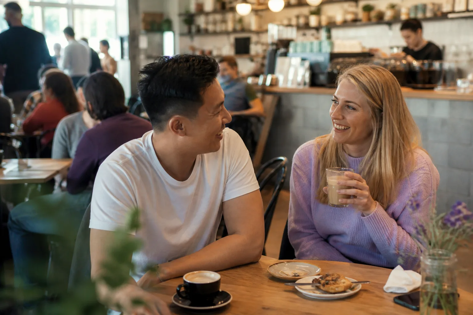 Two people chatting beside the waterfront in a Norfolk market town